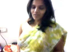 Indian MILF does a little undress tease with saree